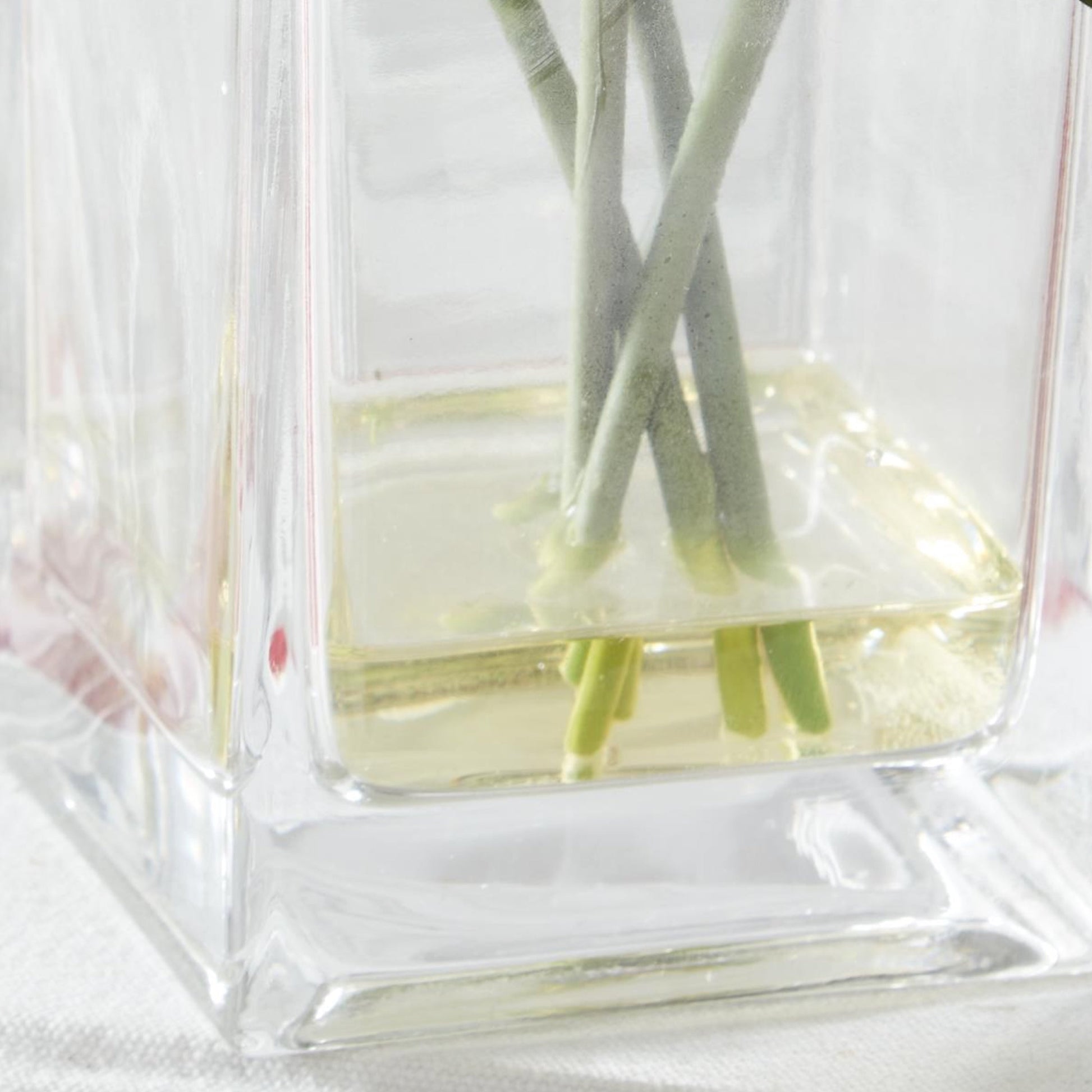 K&K Interiors 8" Real Touch Red Rose Flower Arrangement in Faux Water Glass Vase for Mother's Day