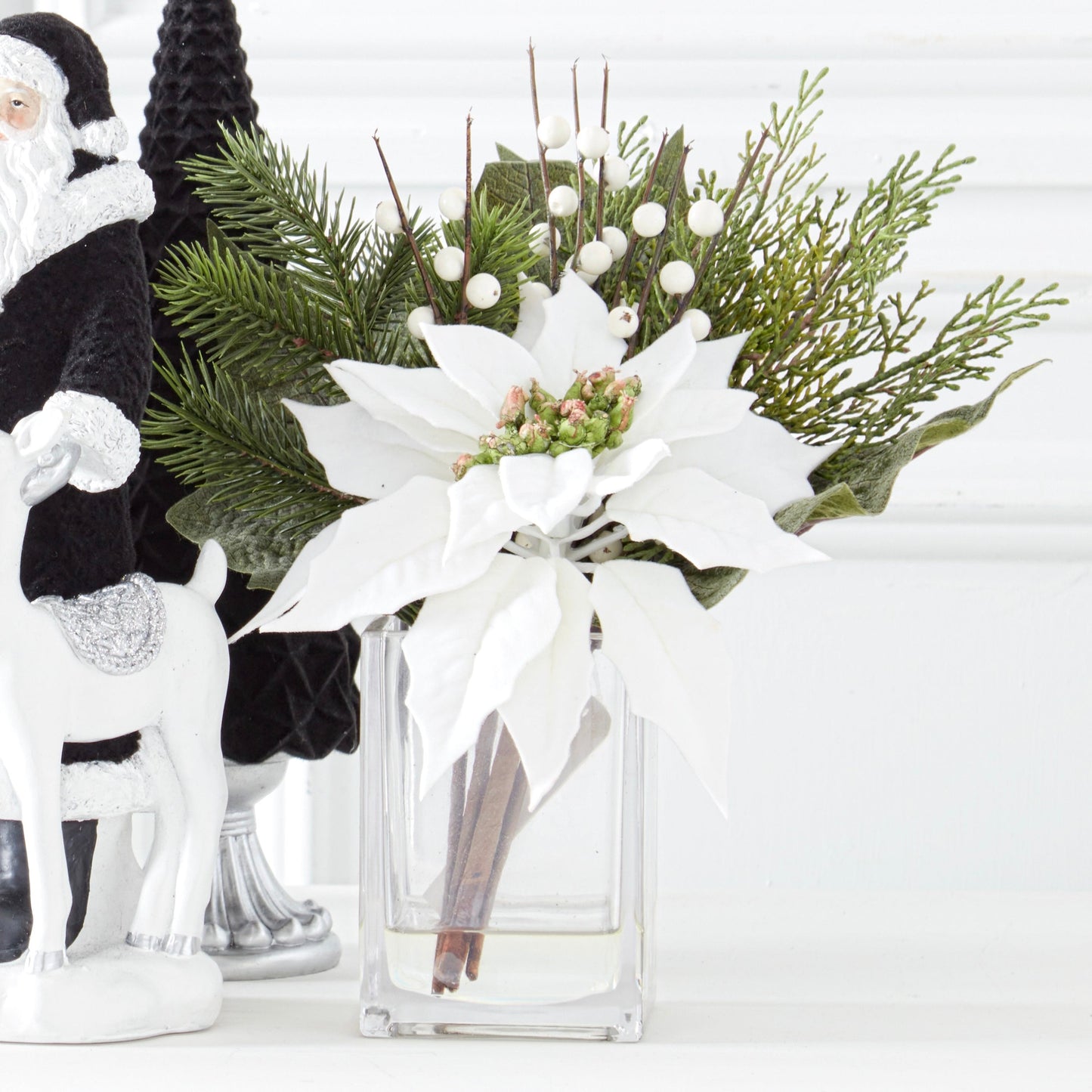 K&K Interiors 11" White Poinsettia Flower Christmas Glass Floral Arrangement with Faux Water