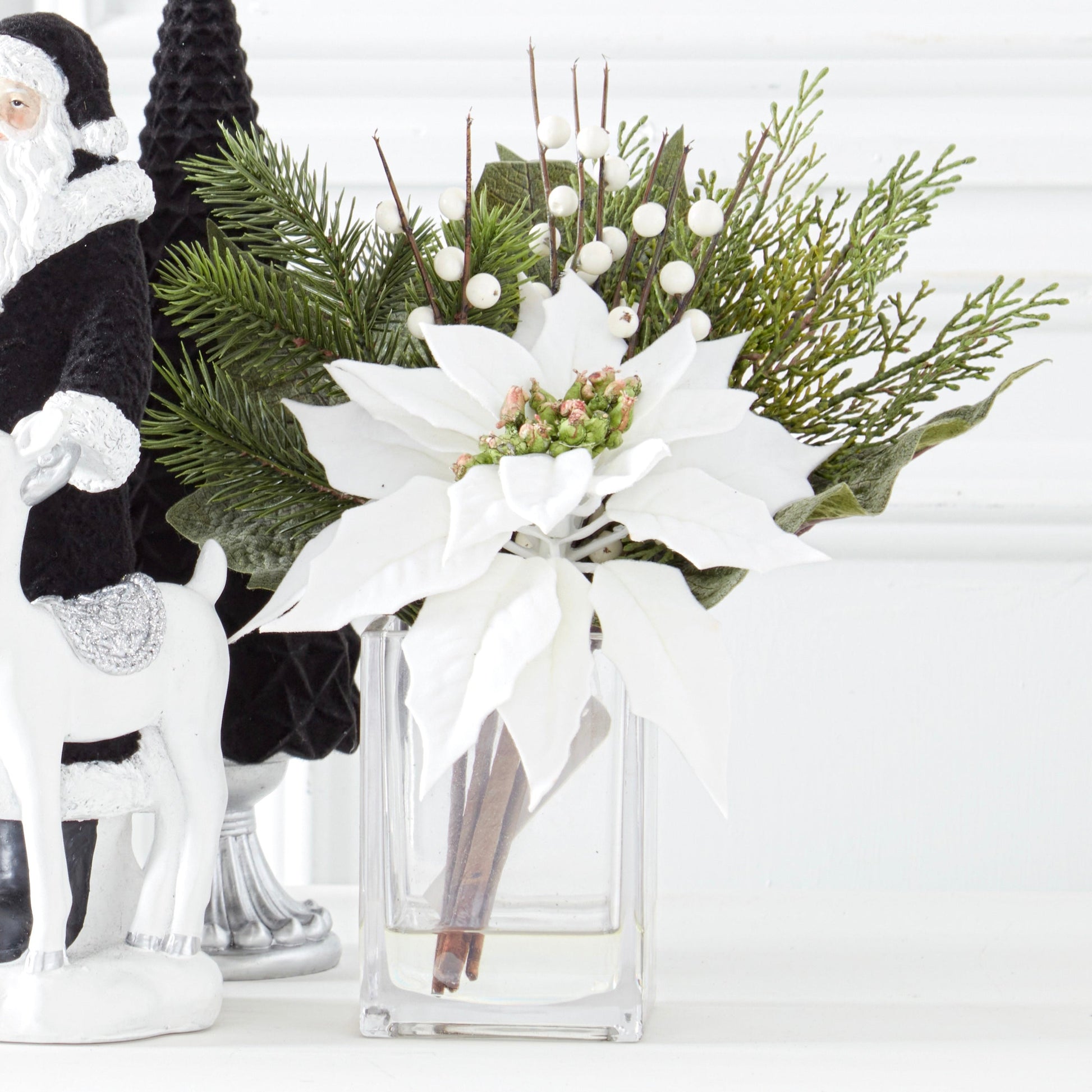 K&K Interiors 11" White Poinsettia Flower Christmas Glass Floral Arrangement with Faux Water