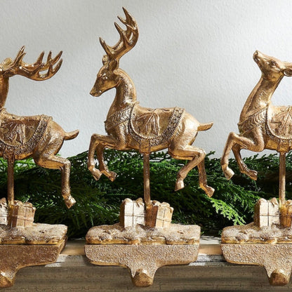RAZ Imports 10.5" Santa and Reindeer Gold Resin Iron Christmas Stocking Holders - Set of 4