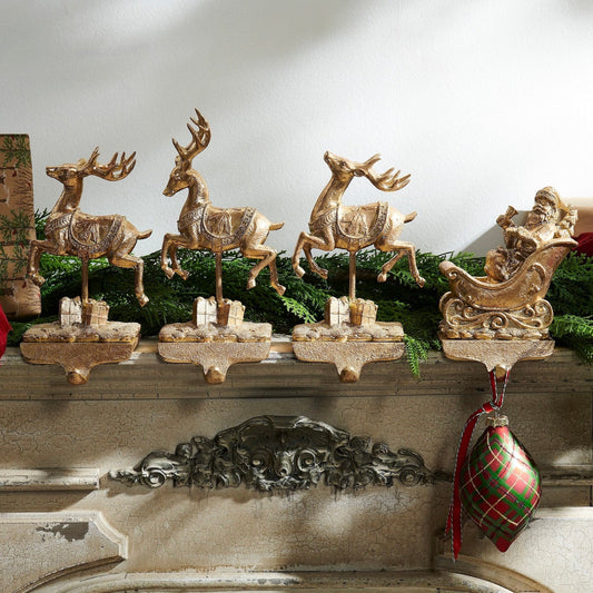 RAZ Imports 10.5" Santa and Reindeer Gold Resin Iron Christmas Stocking Holders - Set of 4